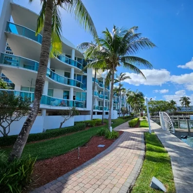 Walkway to a condominium building with palm trees in Miami